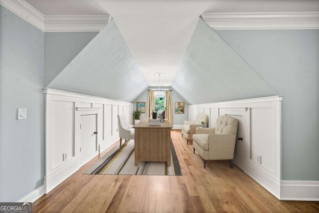 interior space featuring light hardwood / wood-style floors and vaulted ceiling