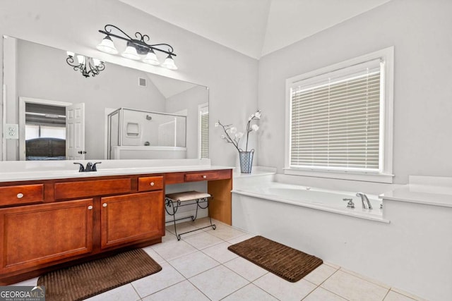 bathroom featuring vanity, a notable chandelier, vaulted ceiling, tile patterned floors, and separate shower and tub