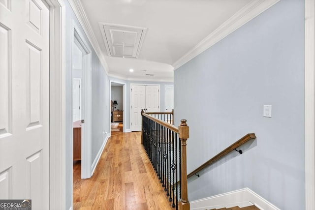 hall featuring crown molding and light wood-type flooring