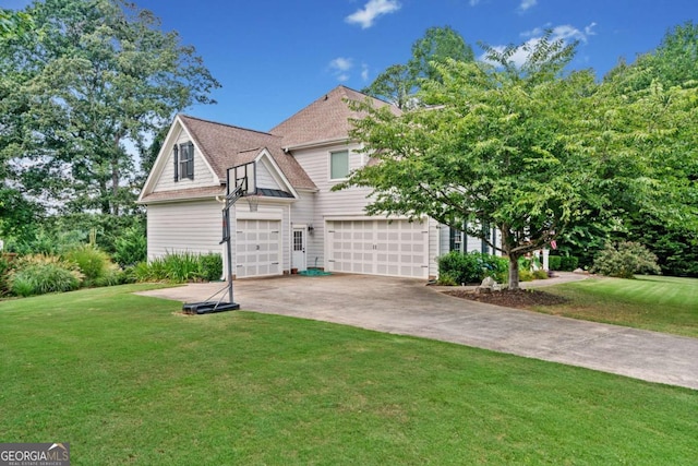 view of front facade featuring a garage and a front lawn