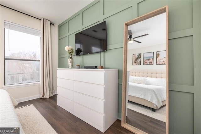 bedroom featuring dark wood-type flooring and ceiling fan