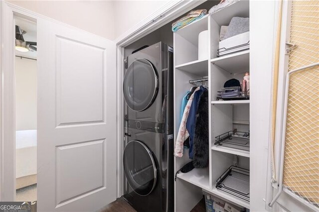 washroom with stacked washer and dryer