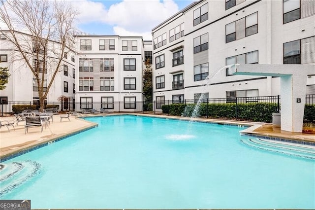 view of pool with pool water feature