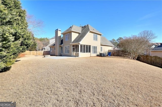 rear view of property featuring a patio area