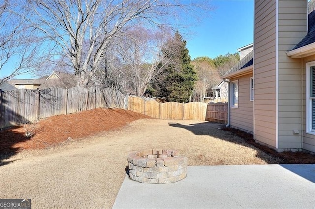 view of yard featuring a patio area and a fire pit