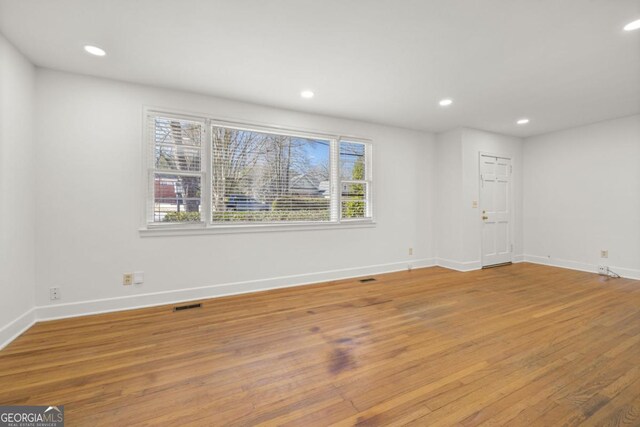 unfurnished room featuring light hardwood / wood-style flooring