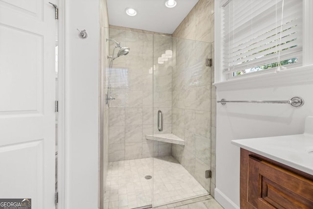 bathroom featuring vanity and walk in shower