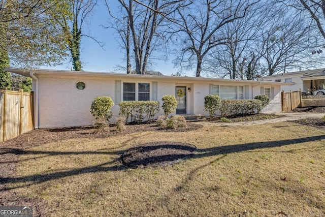 ranch-style house with a front lawn