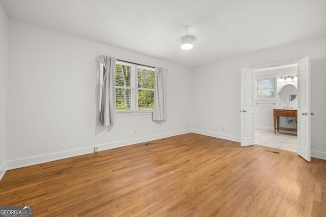 unfurnished room featuring light wood-type flooring