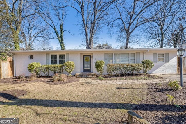 ranch-style house with a front yard