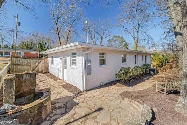 view of side of property featuring a patio area