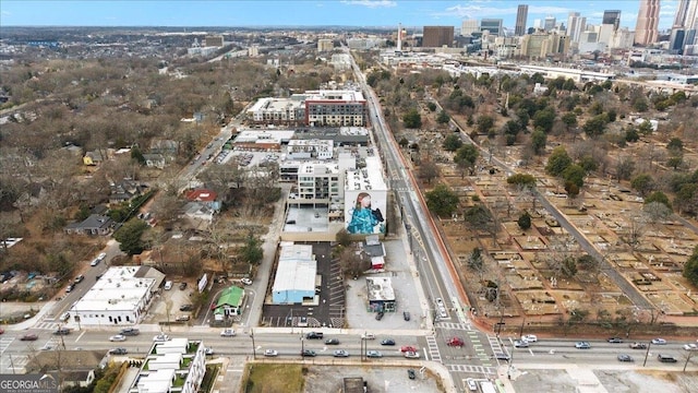 birds eye view of property with a view of city