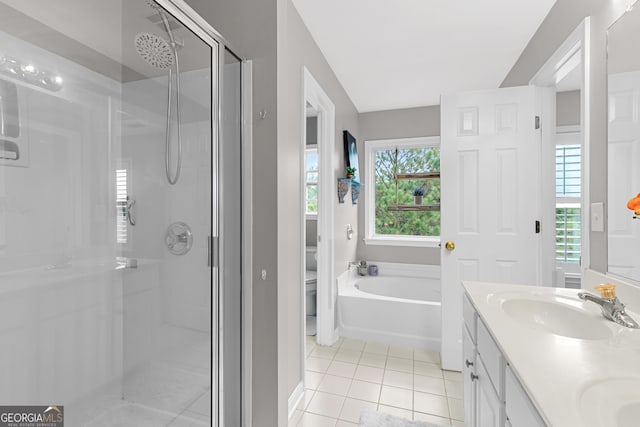 full bathroom featuring vanity, tile patterned floors, toilet, and separate shower and tub