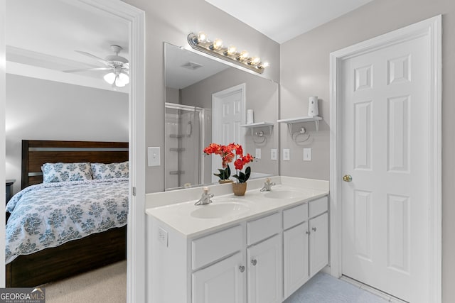 bathroom with vanity, ceiling fan, and walk in shower