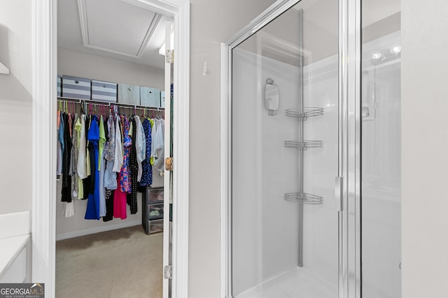 bathroom with a shower with shower door