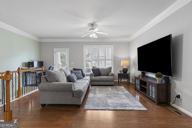 living room with dark hardwood / wood-style flooring, crown molding, and ceiling fan