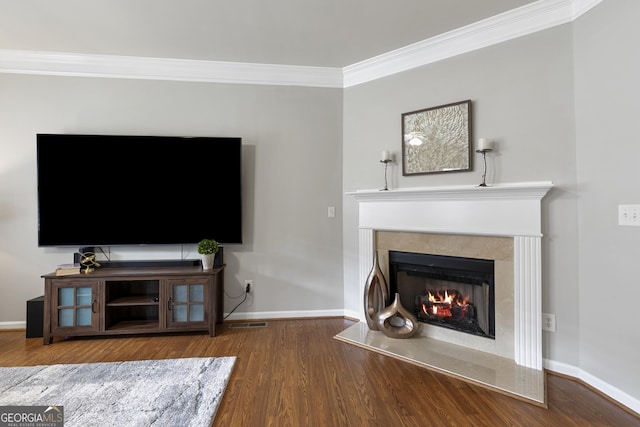 living room with crown molding and wood-type flooring