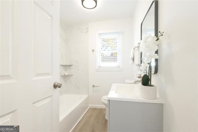 full bathroom with shower / tub combination, vanity, toilet, and wood-type flooring