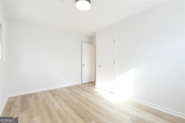 empty room with light wood-type flooring