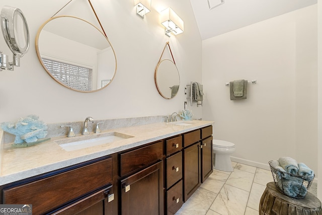 bathroom with vanity and toilet