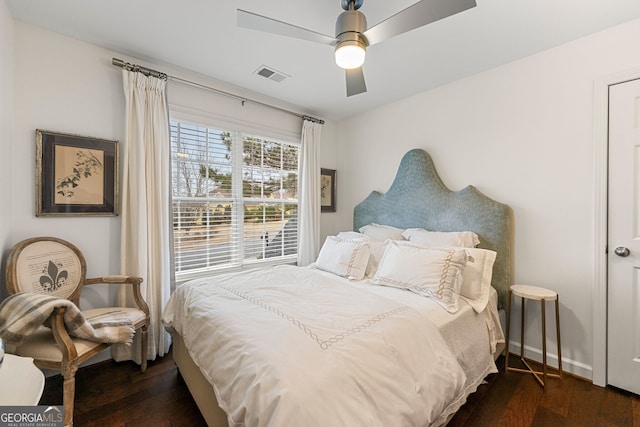 bedroom featuring dark wood-type flooring and ceiling fan