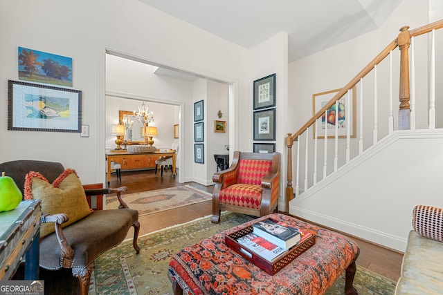 living room featuring hardwood / wood-style flooring and a chandelier