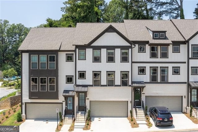 townhome / multi-family property featuring a garage