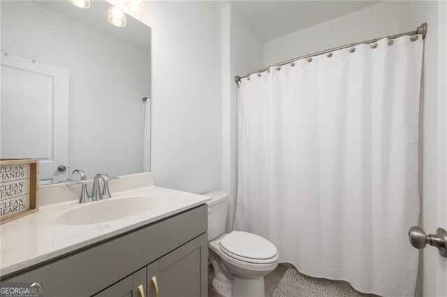 bathroom with vanity and toilet