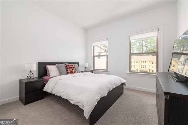 bedroom featuring light carpet