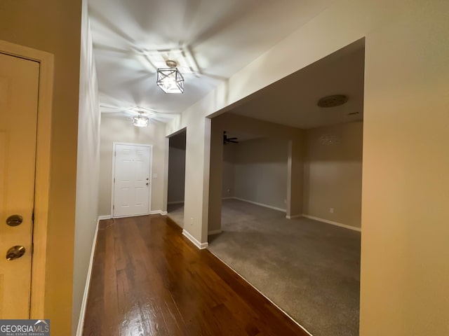 corridor featuring dark hardwood / wood-style floors