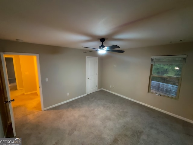 unfurnished bedroom featuring carpet floors and ceiling fan