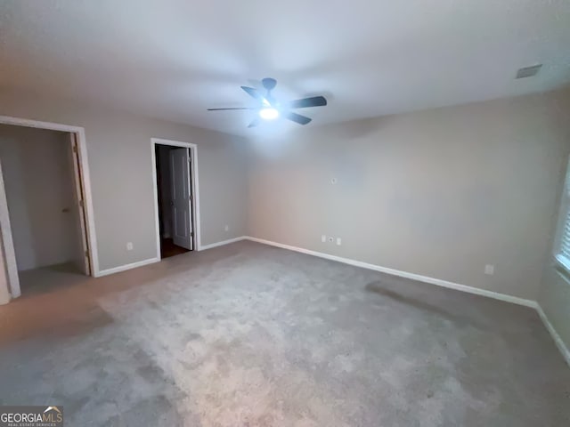 unfurnished bedroom featuring ceiling fan and carpet flooring