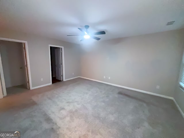 unfurnished bedroom with ceiling fan and carpet flooring