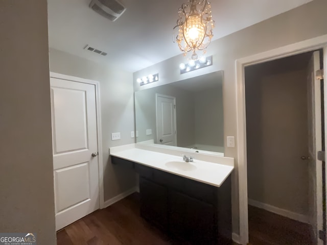 bathroom featuring hardwood / wood-style flooring and vanity
