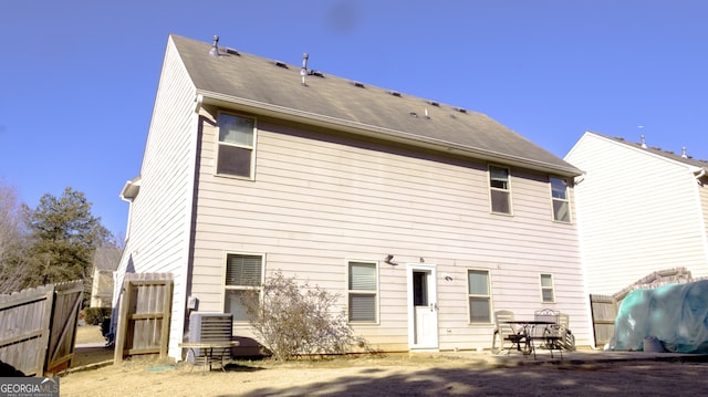 back of house featuring cooling unit and a patio