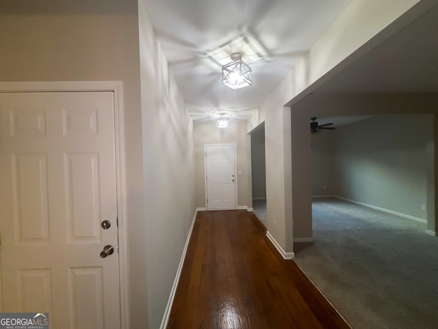 corridor with dark carpet