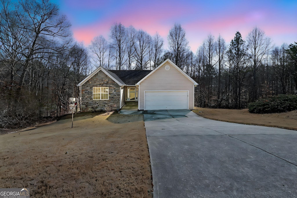 single story home with a garage