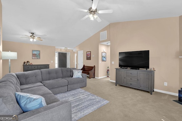 carpeted living room featuring ceiling fan and vaulted ceiling