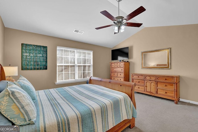 carpeted bedroom featuring vaulted ceiling and ceiling fan