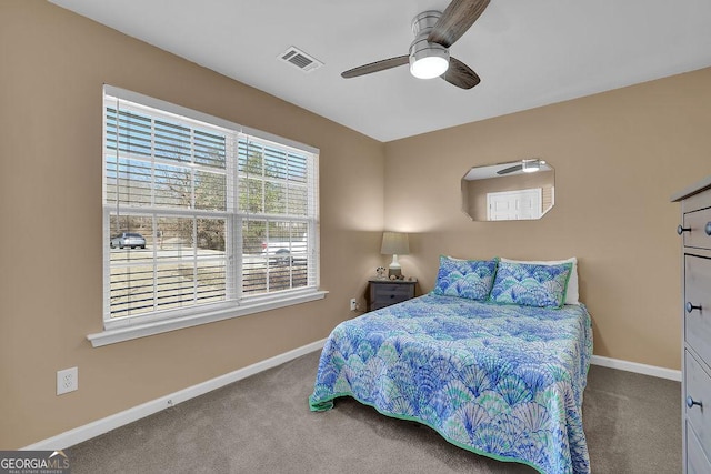 bedroom featuring ceiling fan and carpet