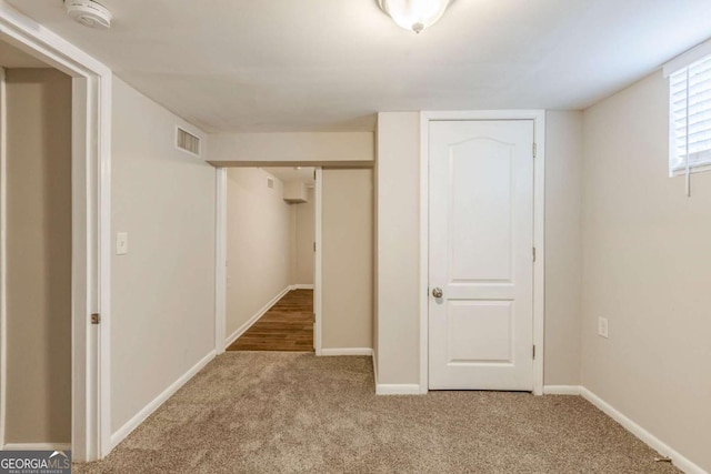 unfurnished bedroom with carpet flooring and a closet