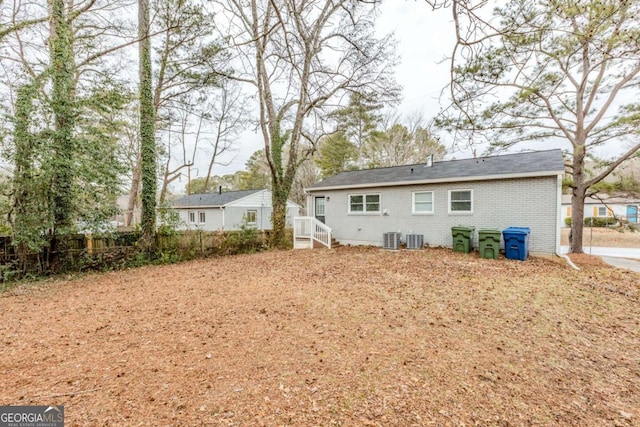 back of house featuring cooling unit