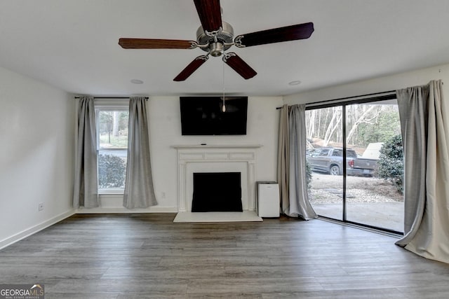 unfurnished living room with hardwood / wood-style flooring