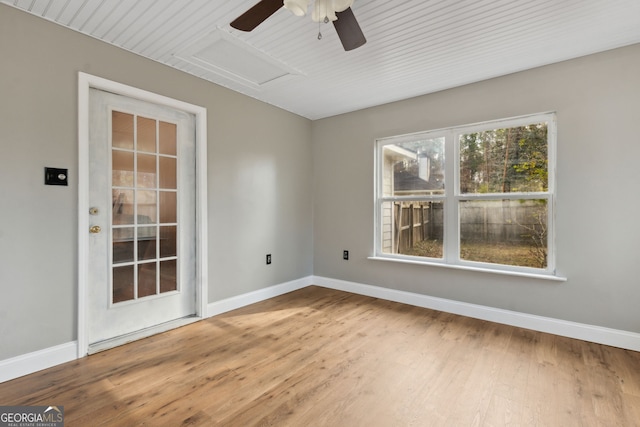 spare room with hardwood / wood-style floors and ceiling fan