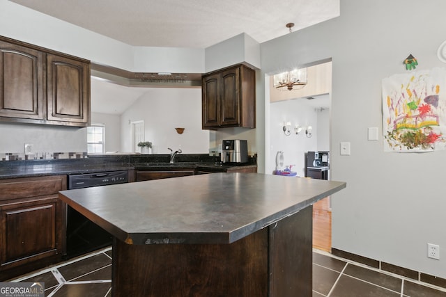 kitchen featuring dark brown cabinetry, sink, a chandelier, stainless steel dishwasher, and dark tile patterned floors