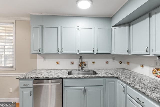 kitchen featuring sink, backsplash, stainless steel dishwasher, and light stone countertops