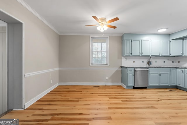 kitchen featuring crown molding, dishwasher, light wood-type flooring, and decorative backsplash