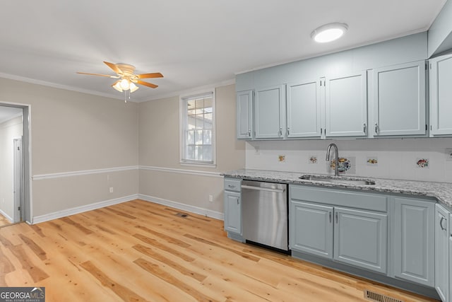 kitchen featuring sink, stainless steel dishwasher, ceiling fan, light stone countertops, and light hardwood / wood-style flooring