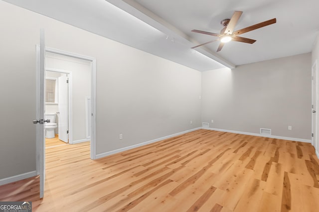 empty room featuring ceiling fan and light hardwood / wood-style floors