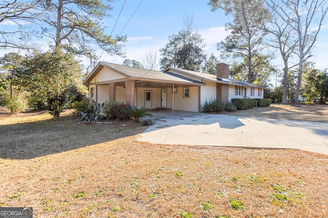 ranch-style home with a carport